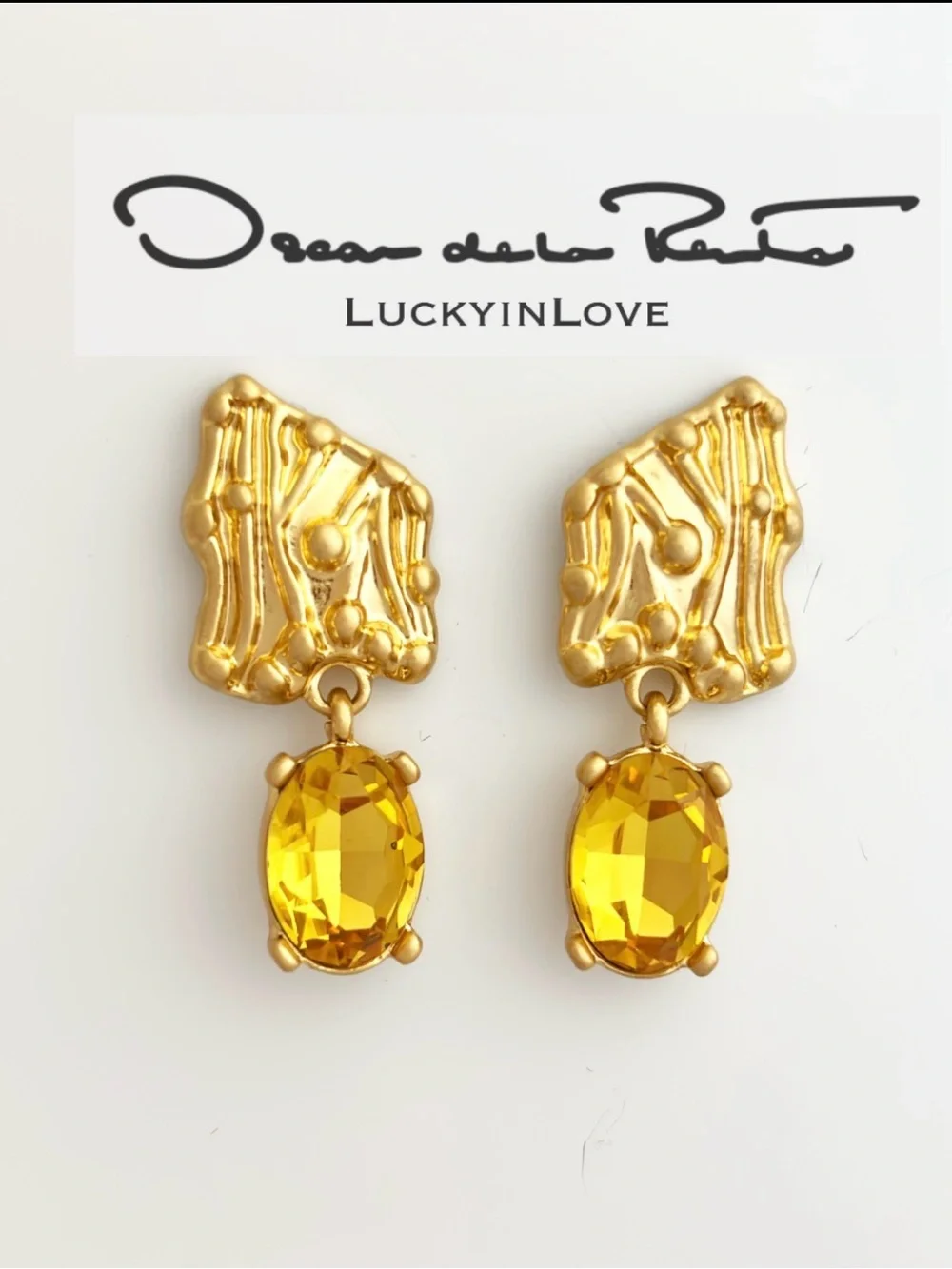 OSCAR DE LA RENTA • Enoki Shield Crystal Drop Earrings in Sunflower Yellow.